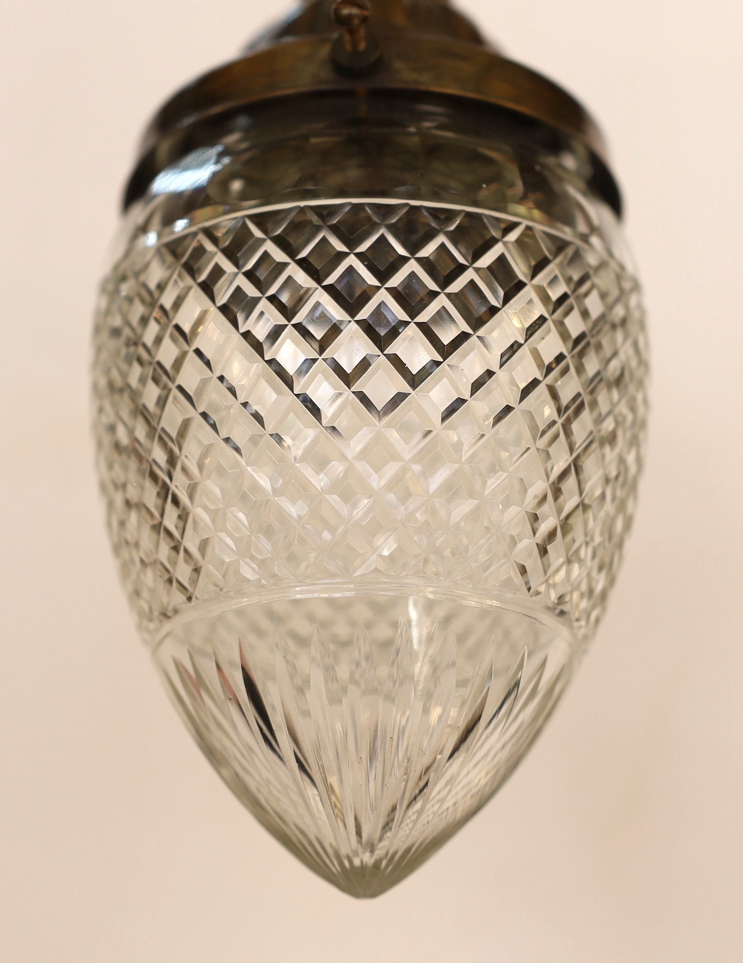 A 1920's English bronzed metal and cut glass light pendant, height 22cm